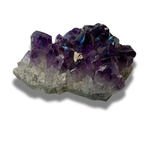 Amethyst crystal cluster on a white background