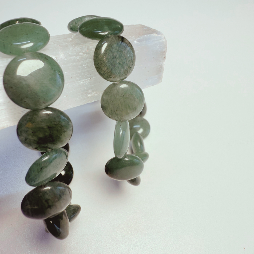 Green stone bracelet on a white background