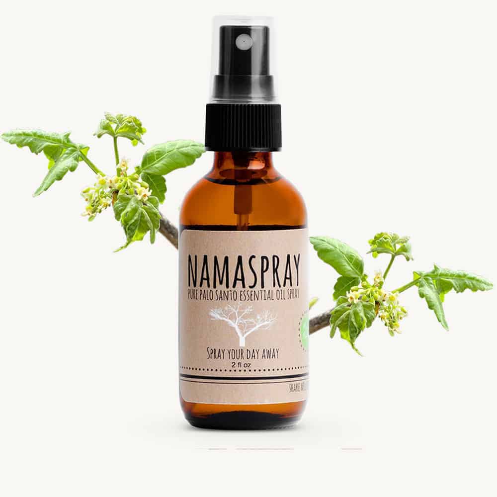 Namaspray bottle with leaves on a white background