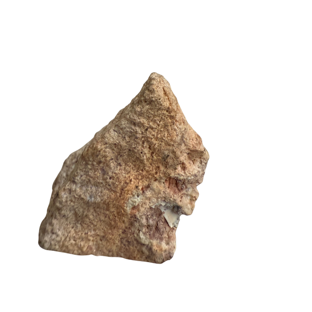 Raw stone arrowhead on a white background