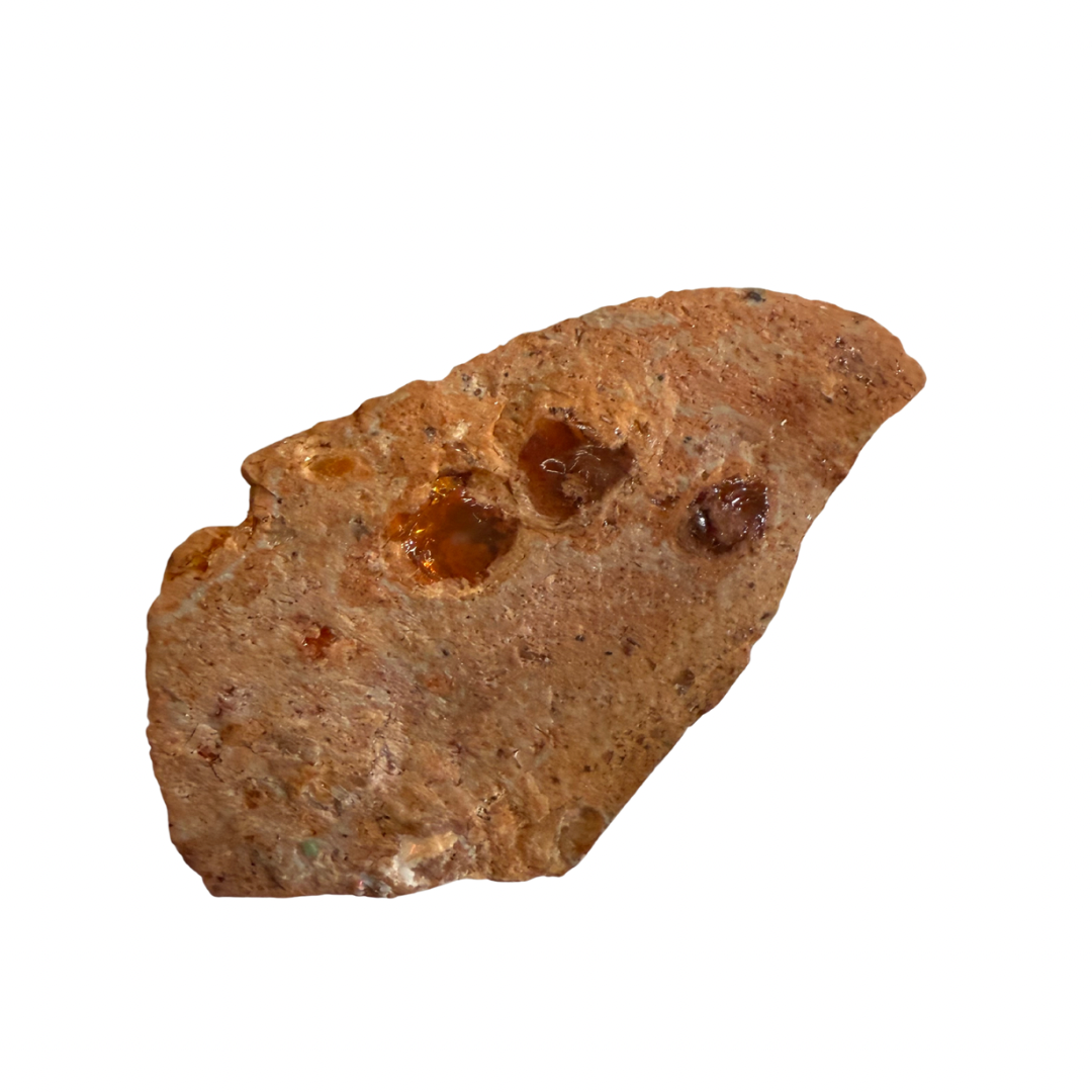 Brown rock with embedded opal minerals on a white background