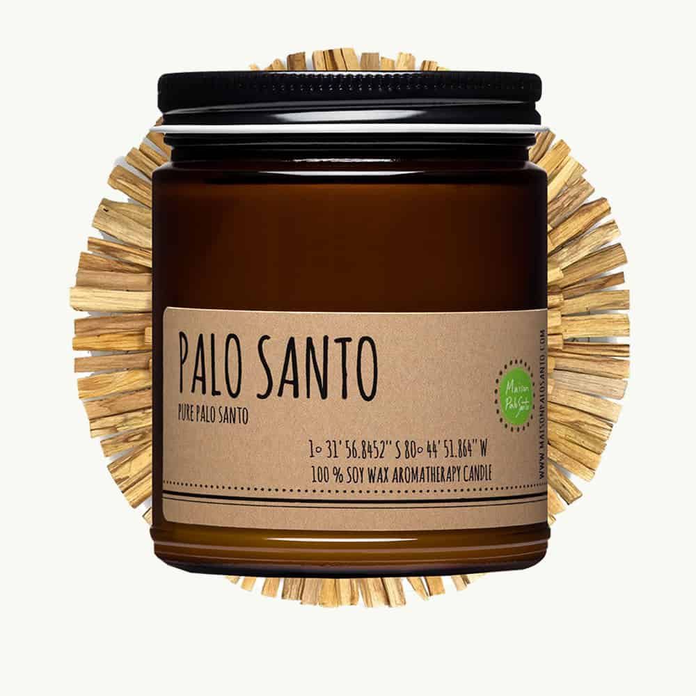 Palo Santo candle with a decorative straw-like base on a white background