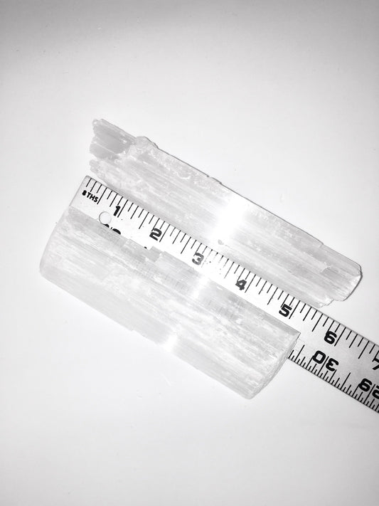 selenite crysta with a ruler showing 5 inches